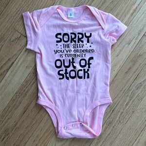 Pink “Sorry the sleep you’ve ordered is currently out of stock” onesie
